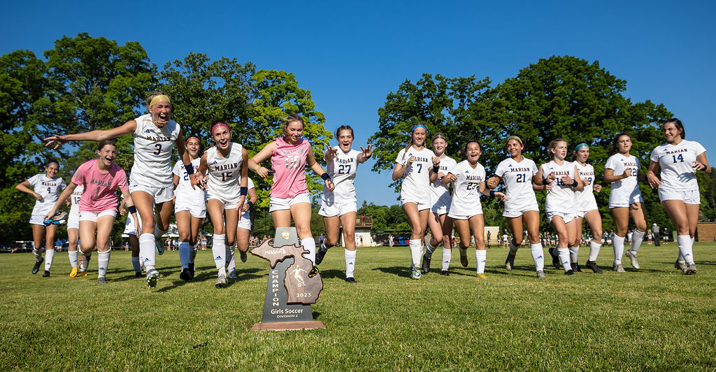 The Mustangs race to scoop up the MHSAA District hardware.