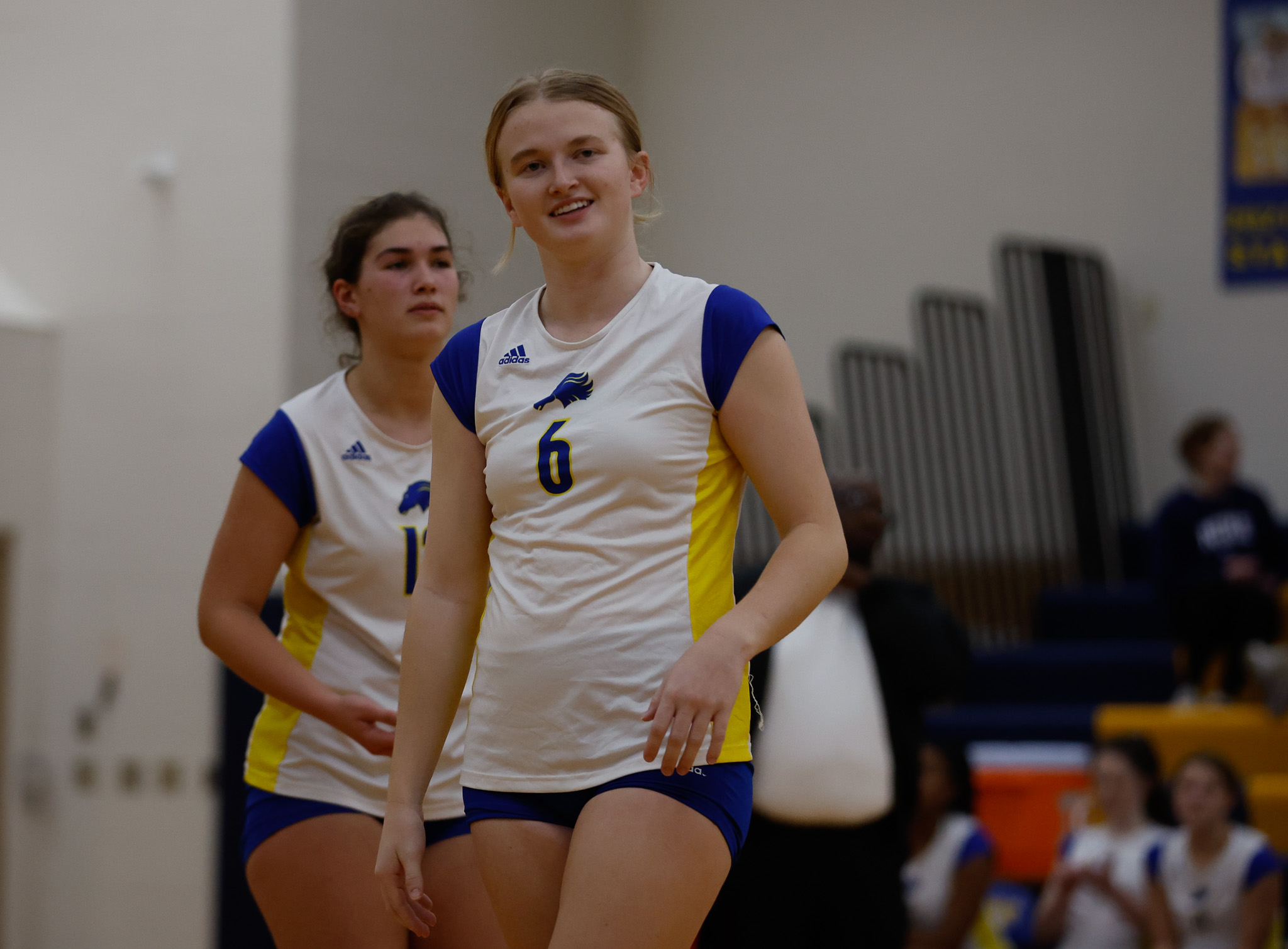Molly Banta smiles during the MHSAA Regional Final Match against Macomb Dakota.